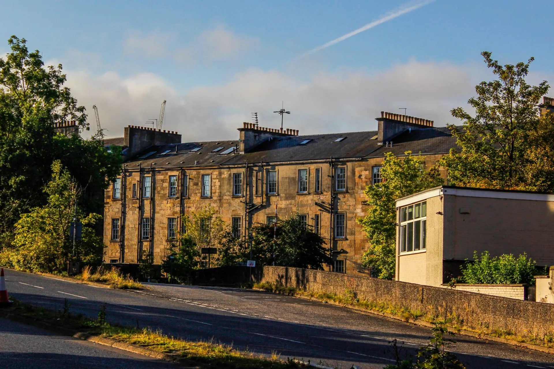 Blonde sandstone tenement flats on a Scottish street